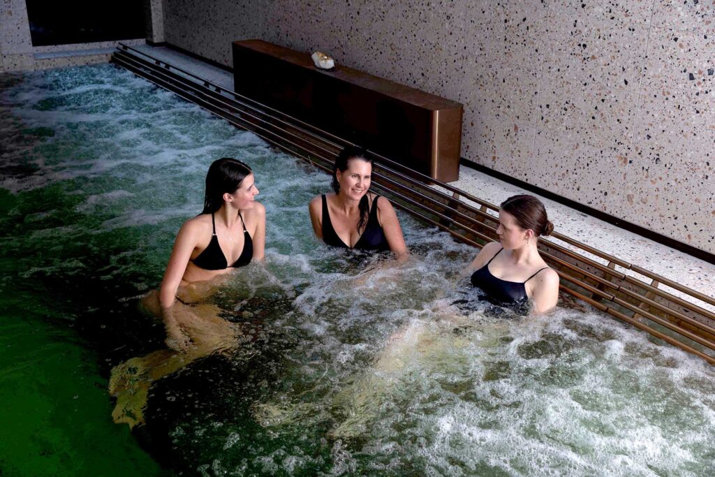 3 friends sitting and enjoying the spa together at Aurora Spa
