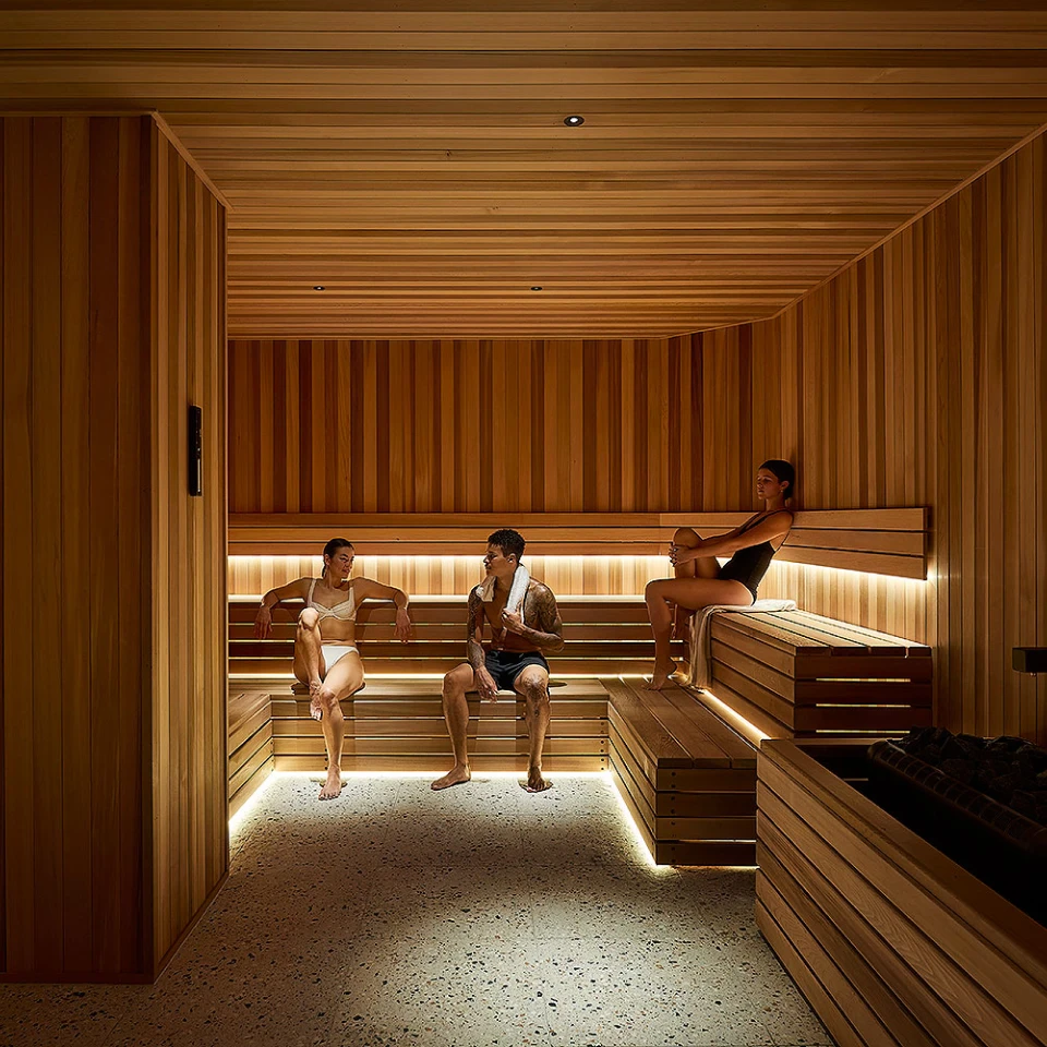 Three people in the Nordic Sauna at Aurora Spa and Bathhouse