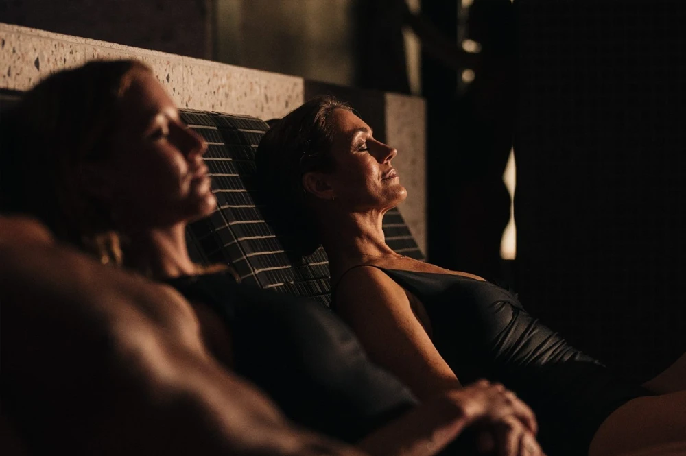 Woman relaxing within the Aurora Bathhouse
