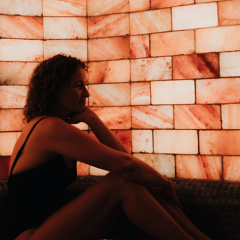 Woman listening to meditation in Halotherapy Salt Room