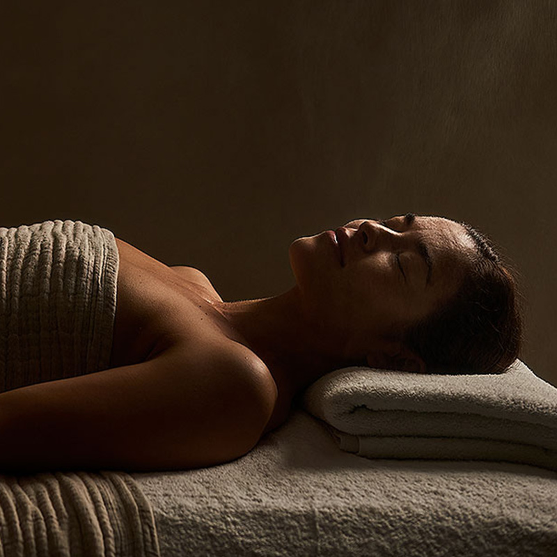 day spa - lady relaxing on spa table